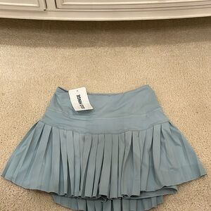 Gold hinge green tennis skirt